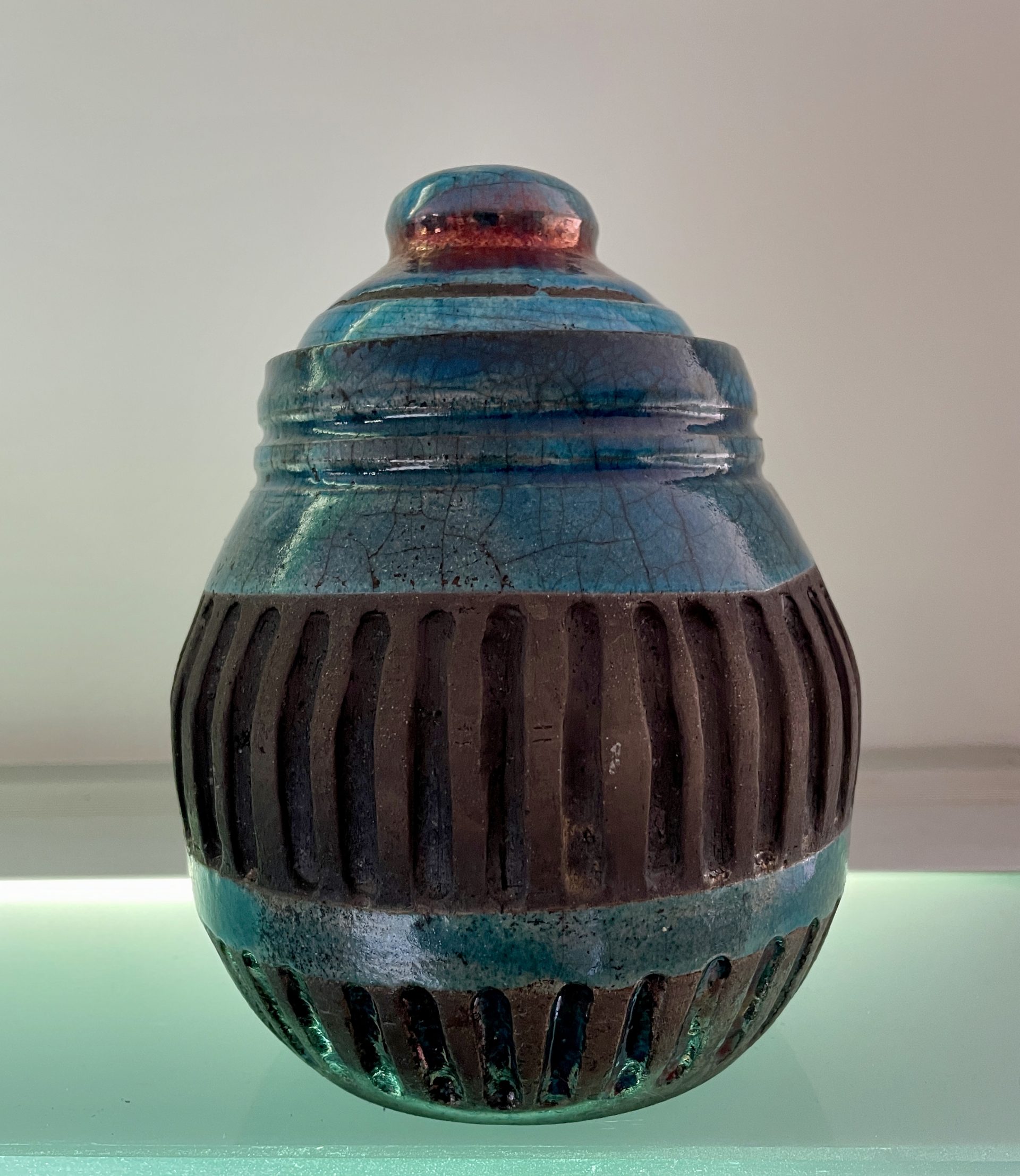 Copper glazed carved raku